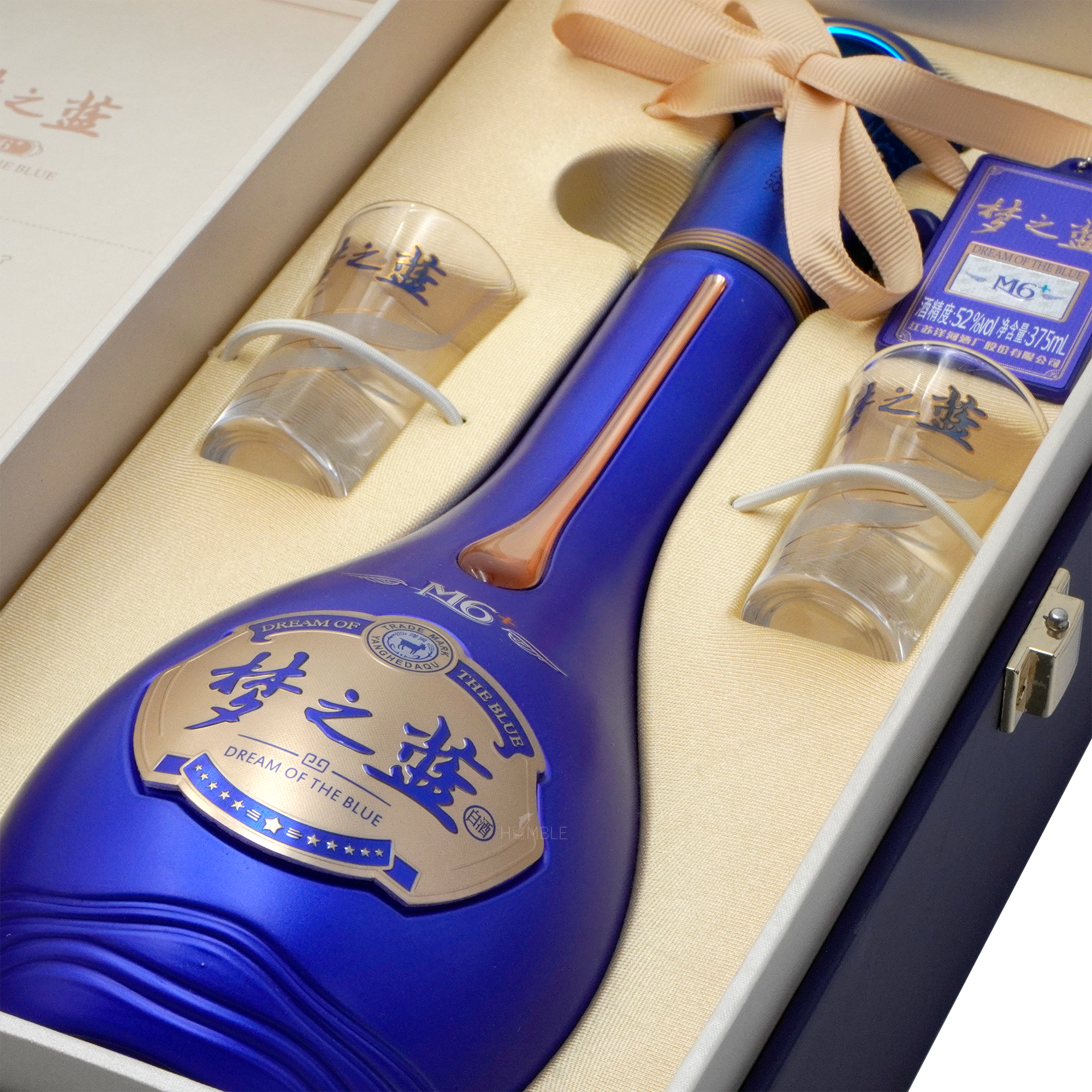 Elegant blue Yang He Meng Zhi Lan Dream Blue M6+ Chinese Baijiu bottle with two branded shot glasses in luxury packaging